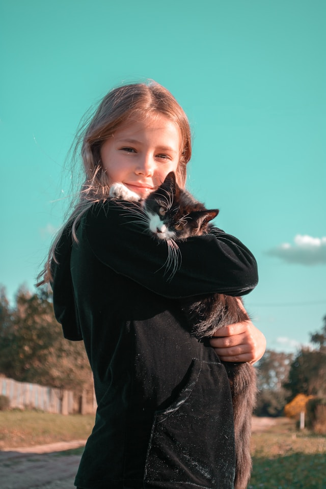 person holding a cat